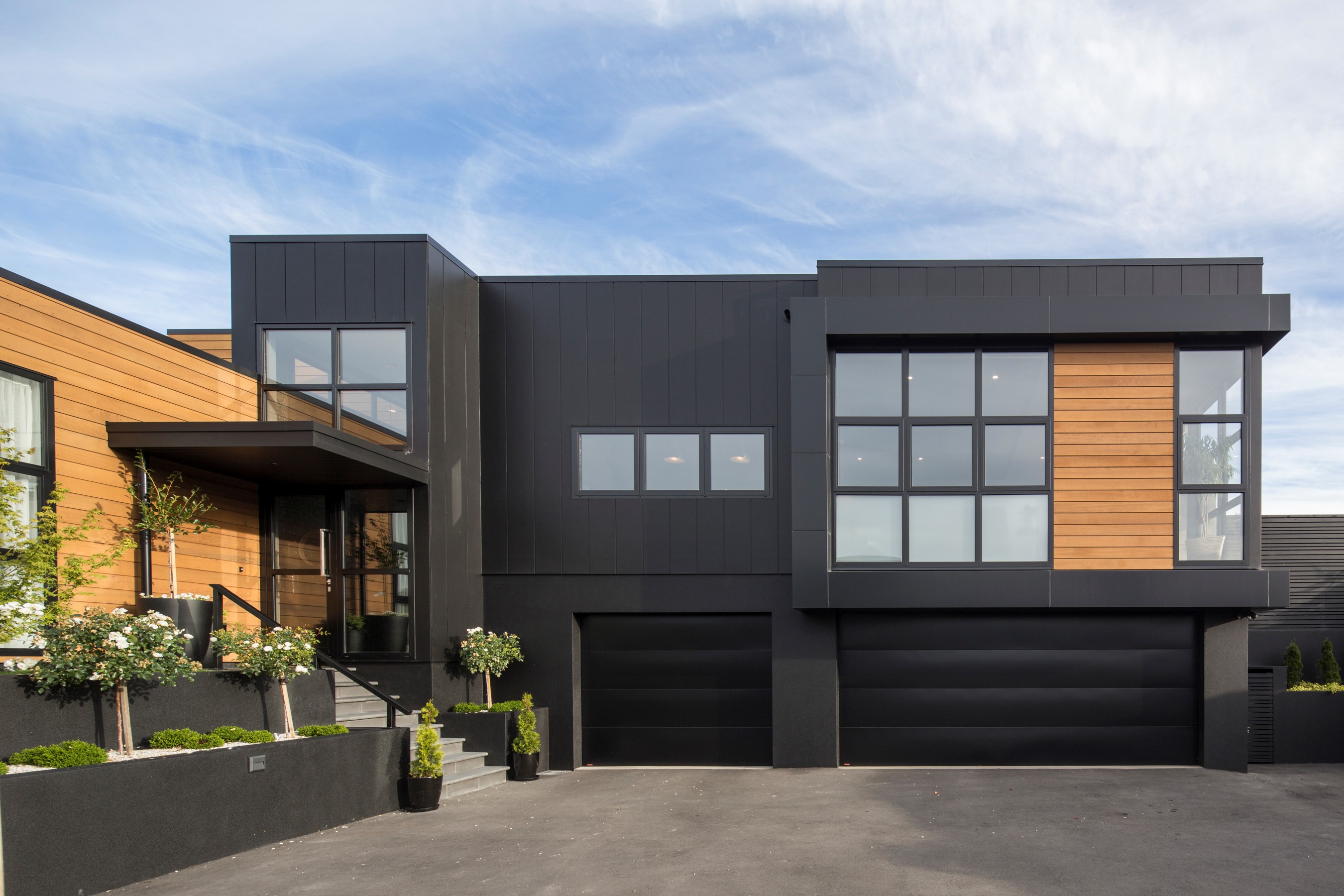 Dunedin-townhouse-entry-steps-alucobond-stria-cedar-weatherboard-landscaping-garage-doors