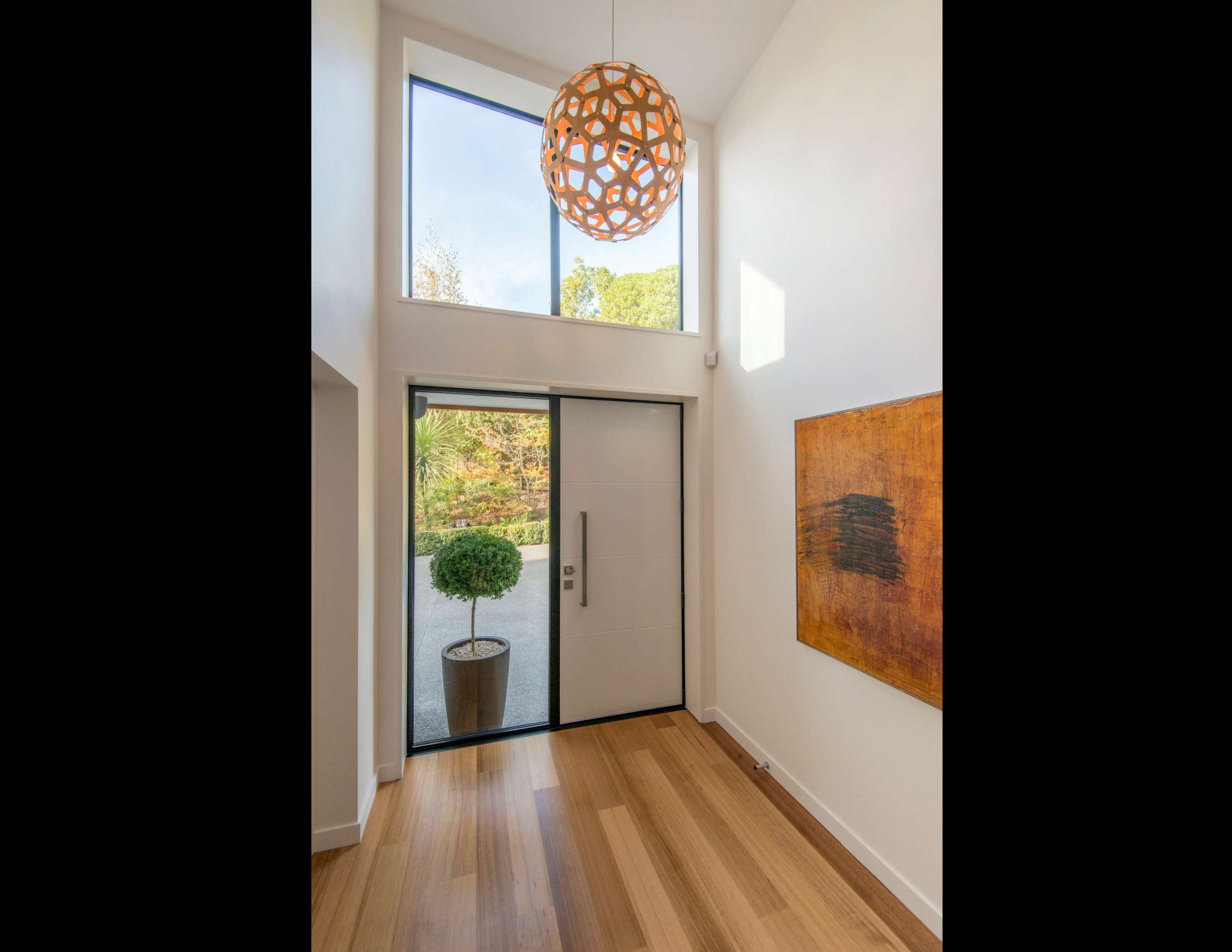 Entry-timber-floor-david-trubridge-light-pendant-double-height