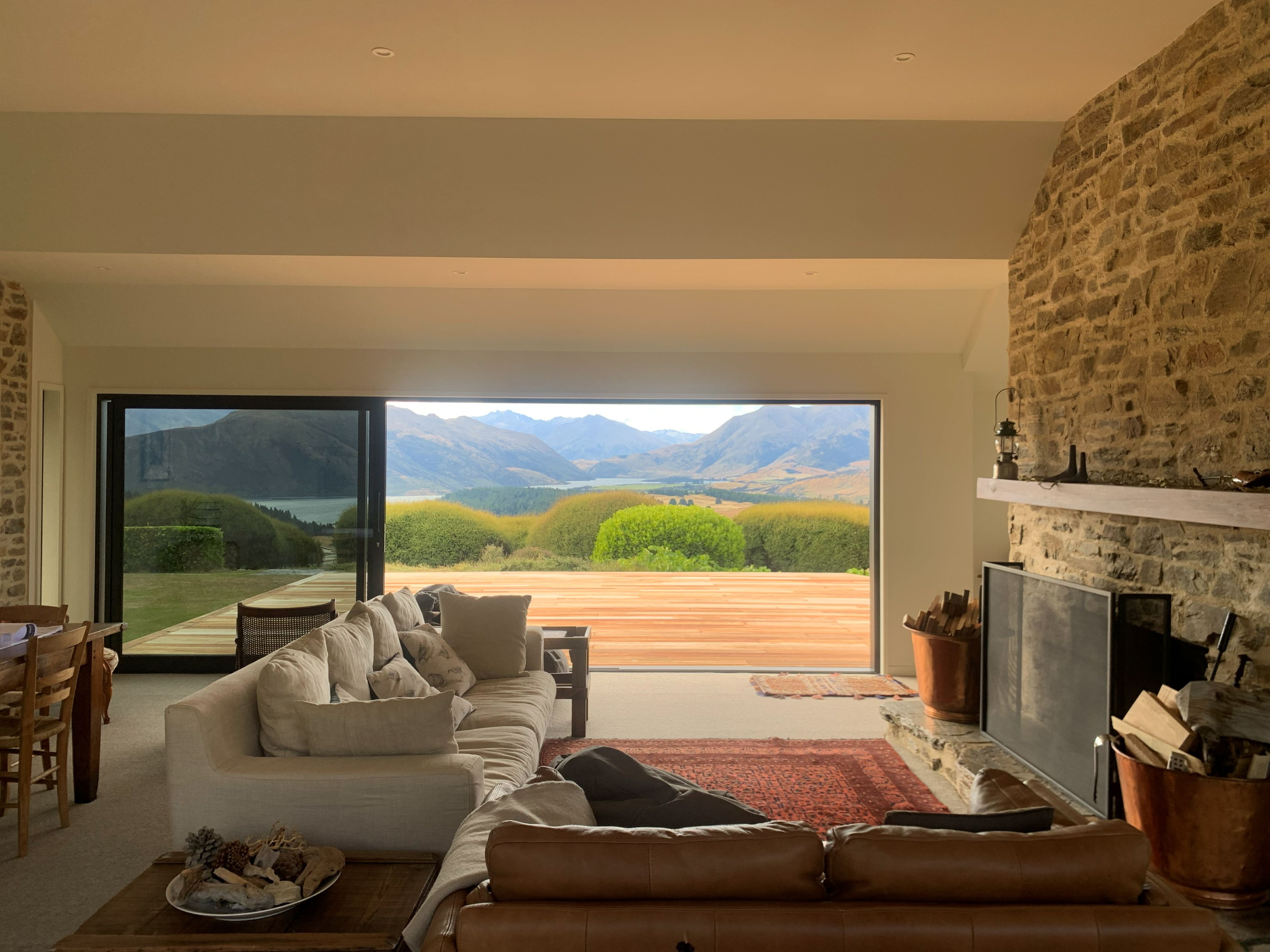 Wanaka-alterations-schist-living-room-fire-place-stacker-door-katipo-design