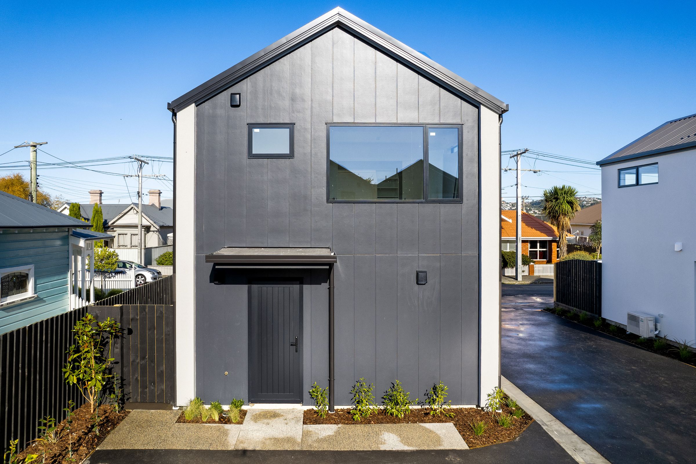 dunedin-stand-alone-townhouse-Stria-Abodo-weatherboard-Sto-render-parking