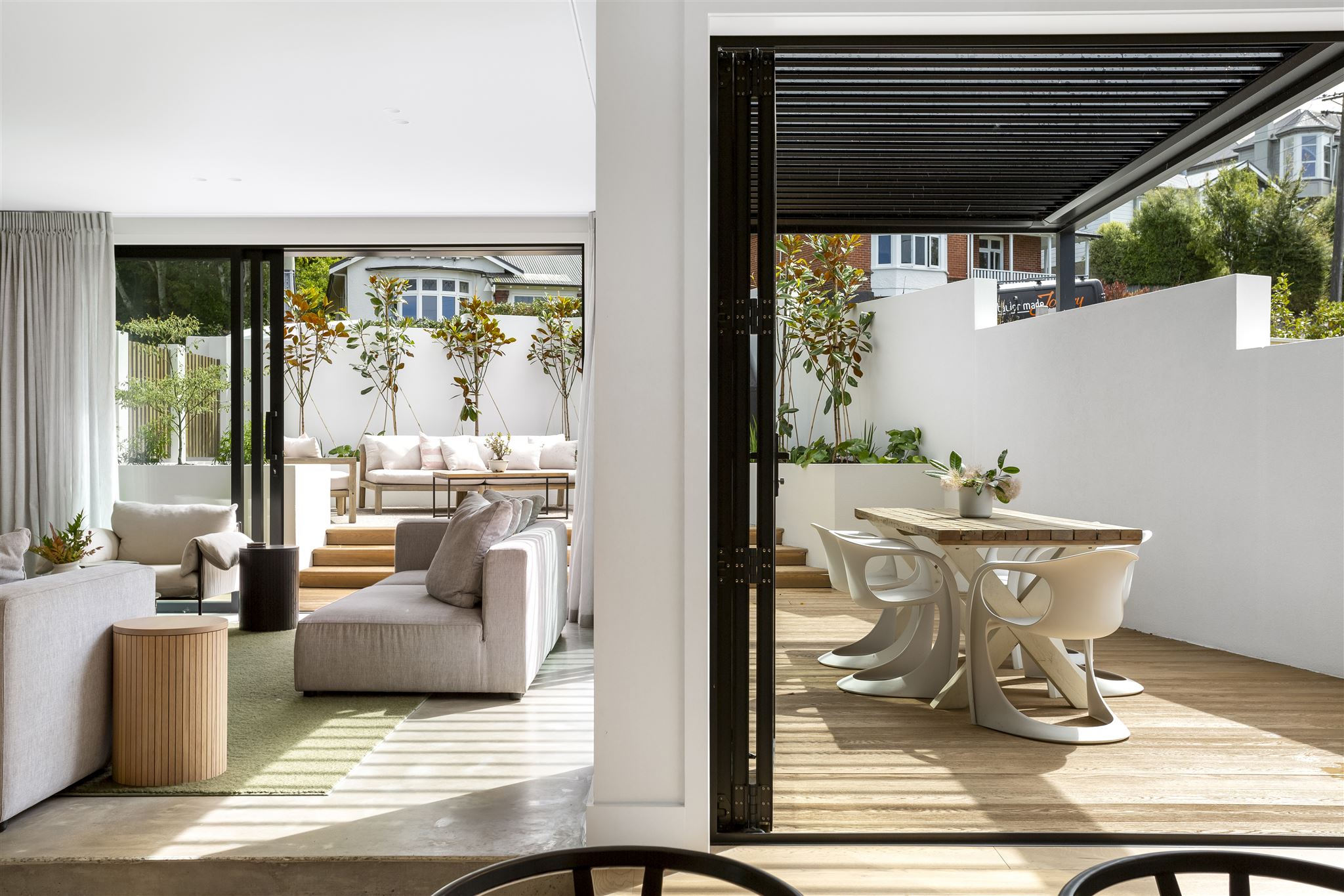 polished-concrete-floor-hardwood-deck-louvre-roof-living-outdoor-flow