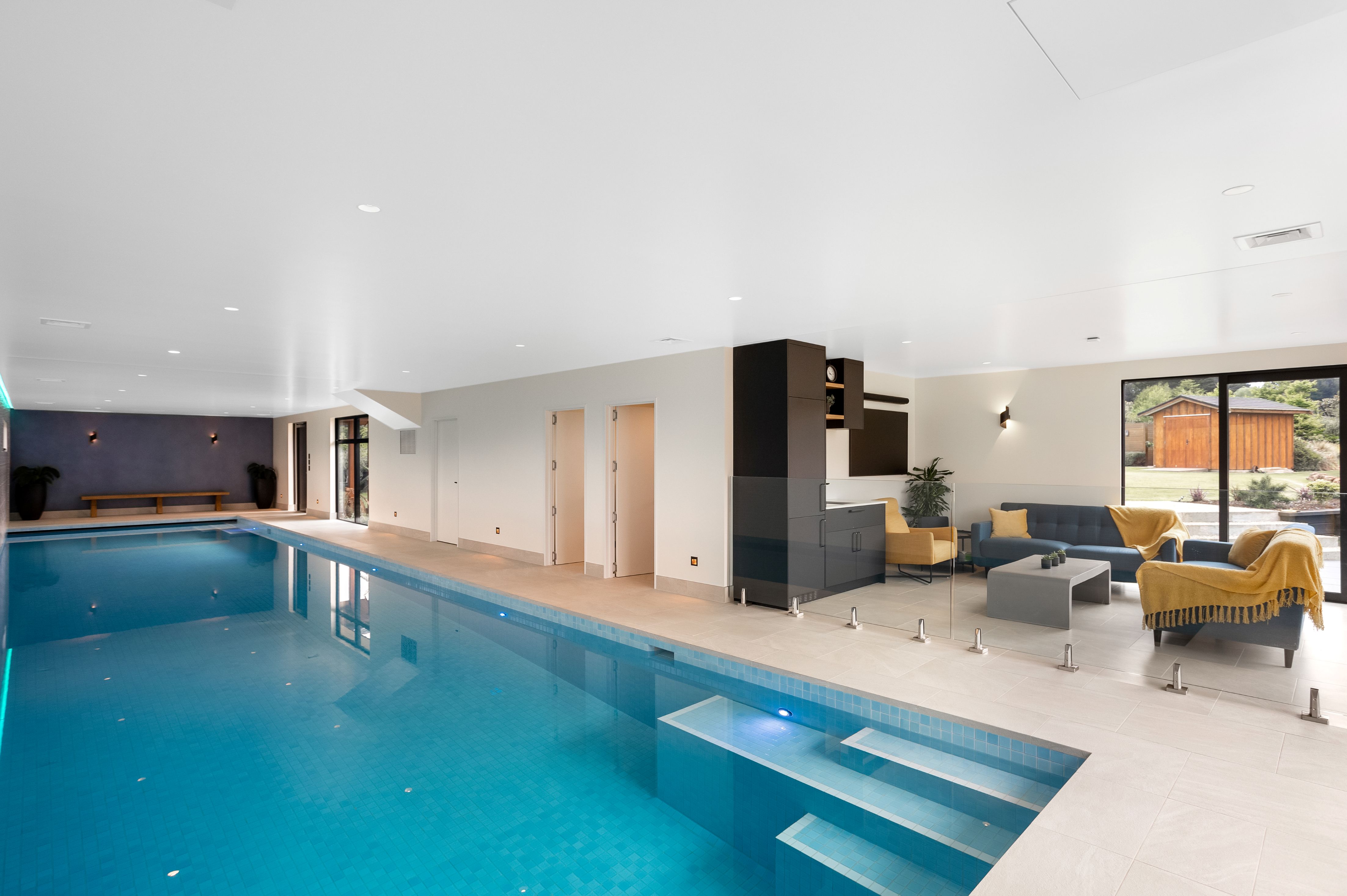 pool-house-indoor-heated-pool-tiled-balustrade-outdoor-patio
